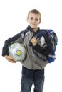 Happy young school boy holding a football ball Royalty Free Stock Photo