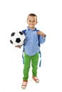 Happy young school boy holding a football Royalty Free Stock Photo