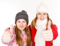 Happy young sisters showing thumbs up Royalty Free Stock Photo