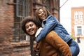 Happy young smiling afro couple hugging, having fun together outdoor Royalty Free Stock Photo