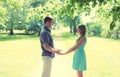 Happy young smiling couple in love, holds hands, relationships, date, wedding - concept, vintage soft colors Royalty Free Stock Photo