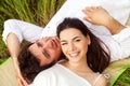 Happy young smiling couple on the summer meadow Royalty Free Stock Photo