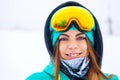 Happy young snowboarder girl in snowboard goggles. Royalty Free Stock Photo