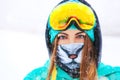 Happy young snowboarder girl in snowboard goggles. Royalty Free Stock Photo