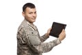 Hispanic soldier holding a tablet