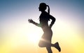 Happy young sports woman running outdoors Royalty Free Stock Photo