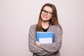 Happy young student girl holding books isolated on white background. Study, education, knowledge, goal concept Royalty Free Stock Photo