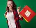 Happy young student woman with shopping bag with books Royalty Free Stock Photo