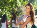 Happy young students outdoors