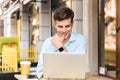 Happy young stylish man in shirt working Royalty Free Stock Photo