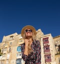 Happy young stylish urban woman posing in Valletta