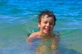 Happy young swims in the sea Royalty Free Stock Photo