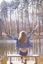 Happy young teen girl near forest lake Royalty Free Stock Photo