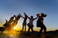 Happy young teens dancing at the beach at beautiful summer sunset Royalty Free Stock Photo