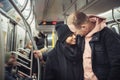 Happy young tourist couple in New York City subway train travel around. Royalty Free Stock Photo