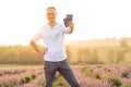 Happy young tourist man holding passport in lavender field Royalty Free Stock Photo