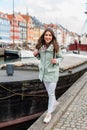 Happy young tourist woman with backpack at Copenhagen Royalty Free Stock Photo