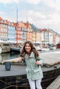 Happy young tourist woman with backpack at Copenhagen Royalty Free Stock Photo