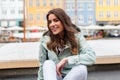 Happy young tourist woman with backpack at Copenhagen Royalty Free Stock Photo