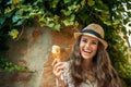 Happy young tourist woman in old Europe town eating ice cream Royalty Free Stock Photo
