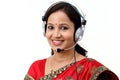 Happy young traditional woman wearing headset Royalty Free Stock Photo