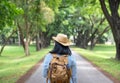 Happy young traveler woman backpacker travel in green natural forest ,greenery fresh air,Freedom wanderlust concept,Alone solo Royalty Free Stock Photo