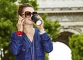 Happy young trendy woman while drinking coffee on Champ Elysees Royalty Free Stock Photo