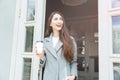 Happy young trendy woman drinking take away coffee Royalty Free Stock Photo