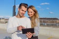 Young urban couple using digital tablet togerher Royalty Free Stock Photo