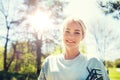 Happy young volunteer woman outdoors