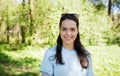 Happy young volunteer woman outdoors