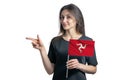 Happy young white woman holding flag Isle of Man and points to the left isolated on a white background