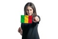 Happy young white woman holding flag of Mali and points forward in front of him isolated on a white background Royalty Free Stock Photo
