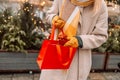 Stylish young beautiful happy woman walk with shopping bags and gift boxes on city street. Cheerful attractive girl Royalty Free Stock Photo