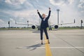 Happy young woman anticipating an upcoming flight Royalty Free Stock Photo