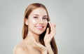 Happy young woman applying cream on her face Royalty Free Stock Photo