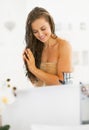 Happy young woman applying hair mask in bathroom Royalty Free Stock Photo