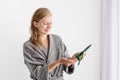 Happy young woman applying hair mask in bathroom Royalty Free Stock Photo