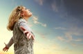 Happy young woman on the autumn sky view