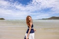 Happy young woman barefoot smile and walking on summer along wave of sea water and sand on the beach Royalty Free Stock Photo