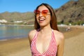 Happy young woman on the beach. Outdoor fashion portrait of lady enjoying her vacation on hot tropical island Royalty Free Stock Photo