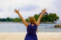 Happy young woman on the beach in sentosa island, singapore Royalty Free Stock Photo