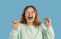 Portrait of funny young woman or teen girl laughing or screaming with mouth wide open Royalty Free Stock Photo