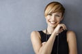 Happy young woman in black dress and pearls Royalty Free Stock Photo