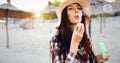 Happy young woman blowing bubbles on the beach Royalty Free Stock Photo