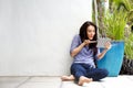 Happy young woman blowing kiss at digital tablet during video call Royalty Free Stock Photo