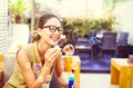 Happy young woman blowing soap bubble in bar restaurant - Beautiful girl having fun outdoor Royalty Free Stock Photo