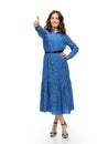 happy young woman in blue dress showing thumbs up Royalty Free Stock Photo