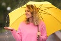 Happy young woman with bright umbrella under rain Royalty Free Stock Photo