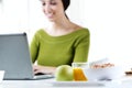 Happy young woman browsing internet at home Royalty Free Stock Photo